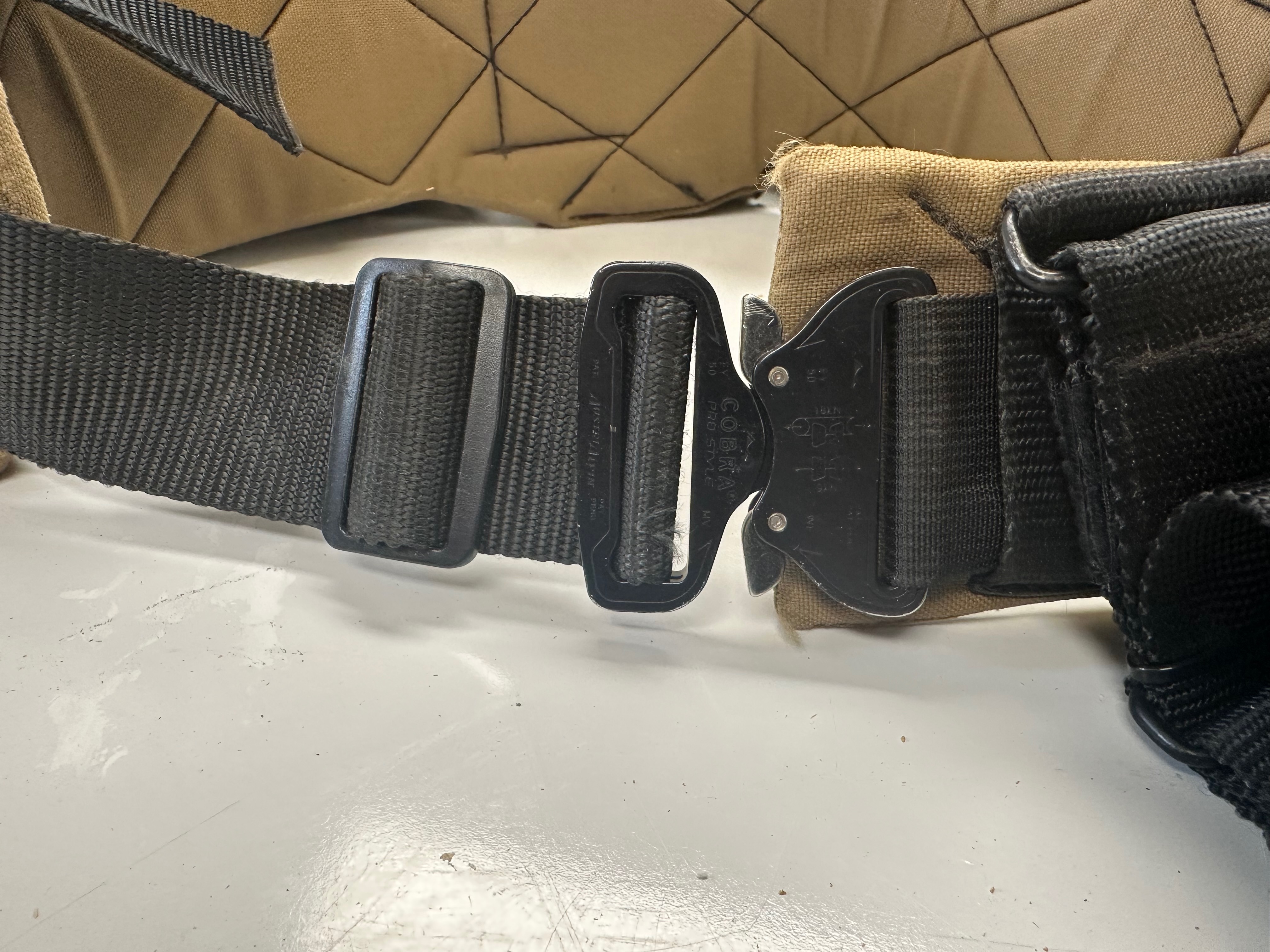 Black COBRA buckle and adjustment webbing on the Badger tool belt.