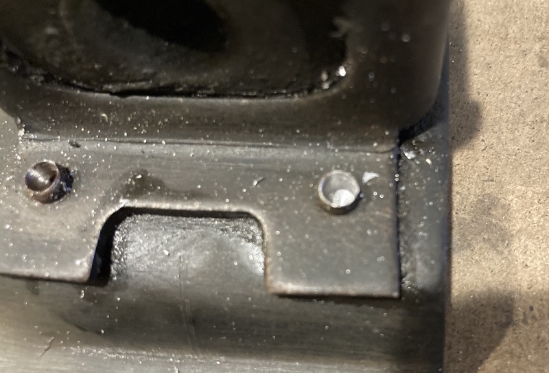 Drilled out rivets in the transmission plate